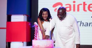 CEO-of-AirtelTigo-Mrs-Mitwa-Kaemba-Ng%u2019ambi-and-Deputy-Minister-of-Communications-Vincent-Sowah-Odotei-cutting-the-anniversary-cake-1-1024x543